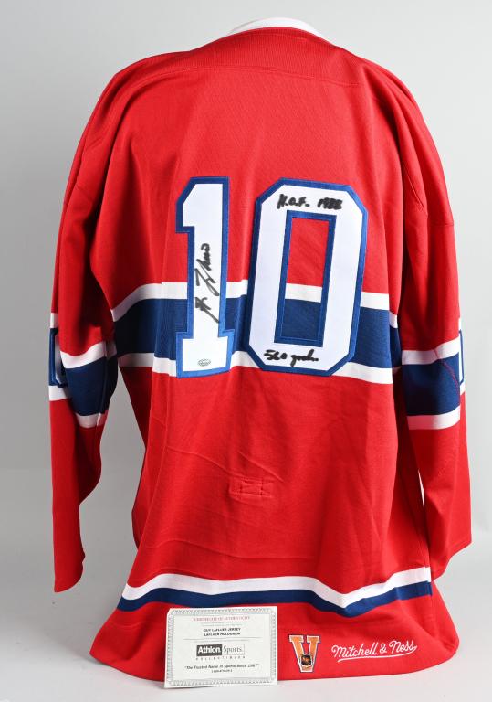 GUY LAFLUER AUTOGRAPHED HOCKEY JERSEY: This is a quality Mitchell & Ness 1972-73 replica Montreal Canadians jersey signed by LAFLUER on back number 1 in black sharpie along with HOF1988 and 560 goals. It comes with a certificate from Athlo
