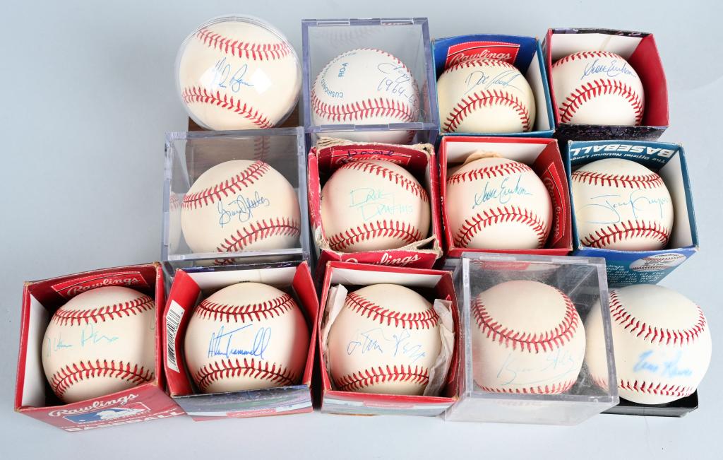 LOT OF (13) AUTOGRAPHED BASEBALL: All but one are single signed. There are two names we can't decipher. All are on official baseballs. Lot includes; Nolan Ryan blue pen, Tony Olive blue pen, Doc Gooden blue pen, Greg Nettles blue pen,