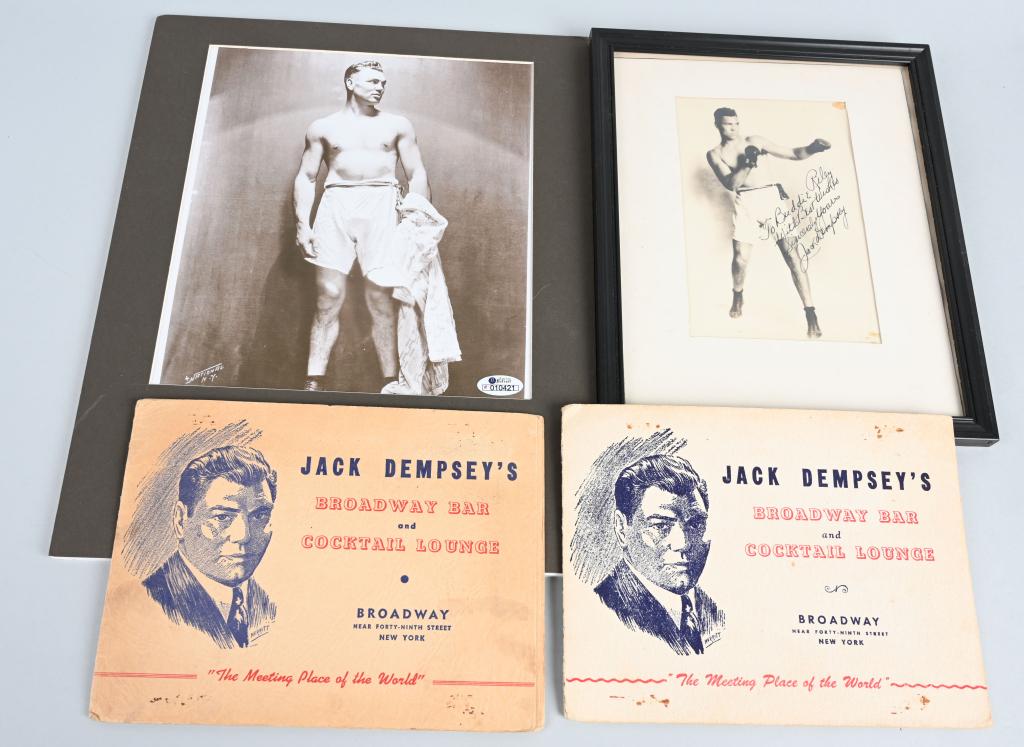 (2) JACK DEMPSEY AUTOGRAPHS: One is an autographed 4x6 picture signed in bold black pen to Buddie Riley. The other is a matted pencil cut with picture. Lot comes with two Dempsey restaurant photo albums.