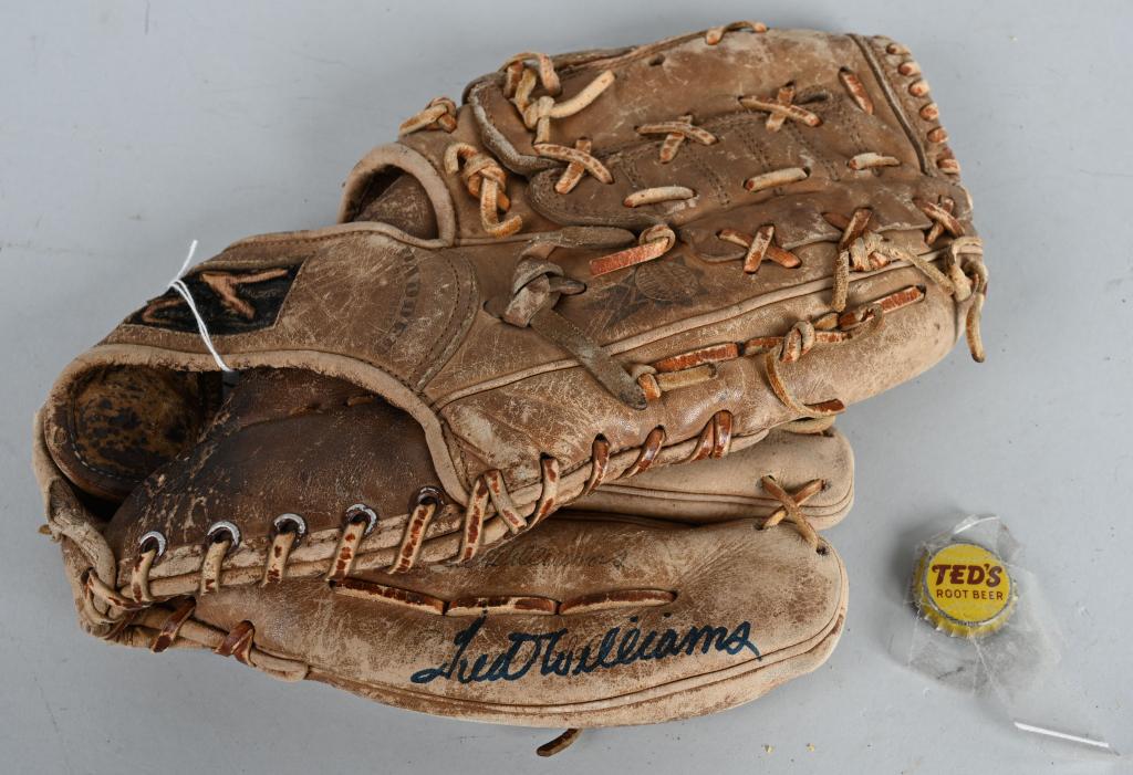 TED WILLIAMS SIGNED BASEBALL GLOVE & PIN: The glove is a RH signature model 1666 signed in blue sharpie on little finger. Comes with an old Teds Root Beer bottle cap. strong 10 autograph on used glove.