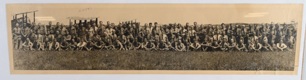 1924 US ARMY AIR SERVICE PANORAMIC PHOTOGRAPH: Elongated 23.5 x 6.5 real photograph on heavy stock, dated on back, shot at Wilber Wright Air Field The aviation team along with three bi-wing aero planes are featured. One man is singled out in pen "