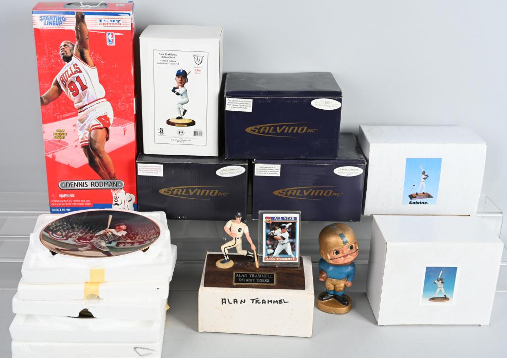 LOT OF 12 SPORTS STATUES, PLATES AND BOBBING HEADS: All are near new and most have original boxes. Includes Ro0dman, Sosa, Randy Johnson, etc. Makers Salvino, Starting lineup, etc.
