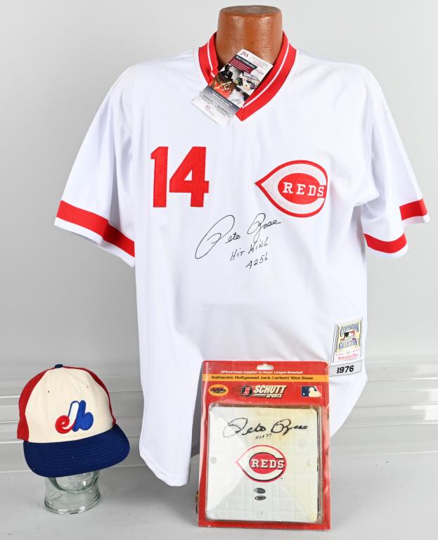 AUTOGRAPHED PETE ROSE JERSEY, HAT AND BASE: JSA ON Reds home, signed in black sharpie, Roman Pro size 7 Expos hat signed by Rose under bill and a signed Reds mini base.