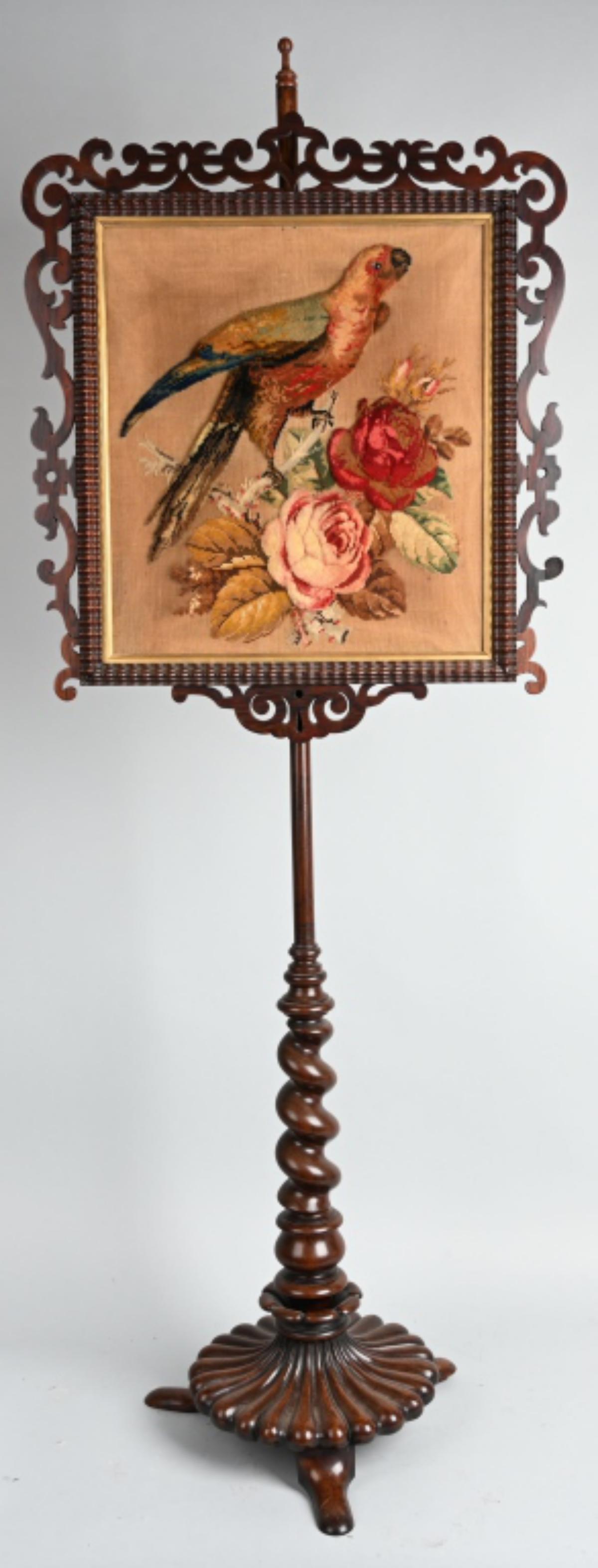 VICTORIAN POLE SCREEN, NEEDLEPOINT TAPESTRY: Very nice antique adjustable Pole Screen with needlepoint parrot and Roses. Well carved stand and frame. Hand carved mahogany wood. Upper left corner of frame has glue repair. 65" high, needlepoint is