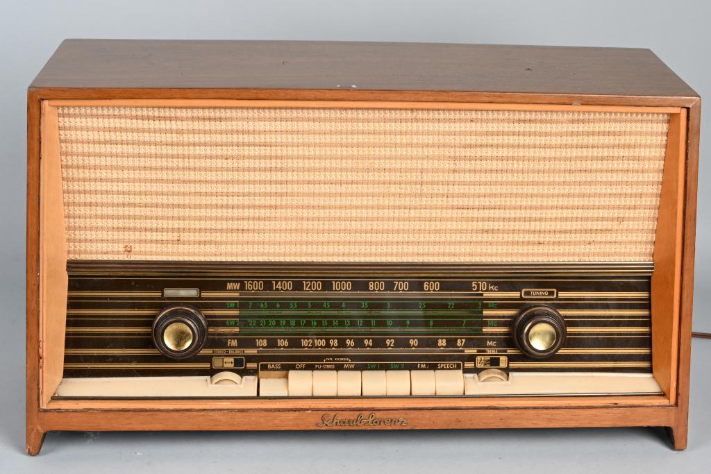 SCHAUB LORENZ SAVOY STEREO 10 RADIO: Quality vintage radio made in Germany. Lights up and hummed when tested. Nice cabinet with light wear. 23" by 13" by 9". Very Good-Excellent