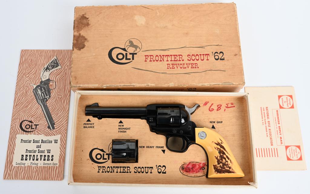 BOXED COLT FRONTIER SCOUT '62 REVOLVER: SERIAL 23782P. BARREL 4 3/4". CALIBER - 2-CYLINDERS .22 LONG RIFLE & .22 MAGNUM. MADE IN 1965. This revolver is as new, unfired in the original box with paperwork. Original price of $68.50 written ins