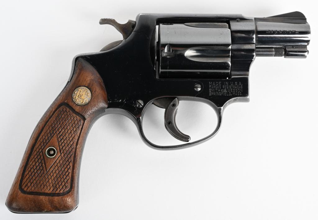 SMITH & WESSON MODEL 36 FLAT LATCH REVOLVER: SERIAL NUMBER 335034, BARREL 2", CALIBER .38 SPECIAL. MANUFACTURED PRE-1968. J-frame Smith & Wesson with Square butt grip. Checkered diamond pattern grips with factory monograms. Case colored hammer a