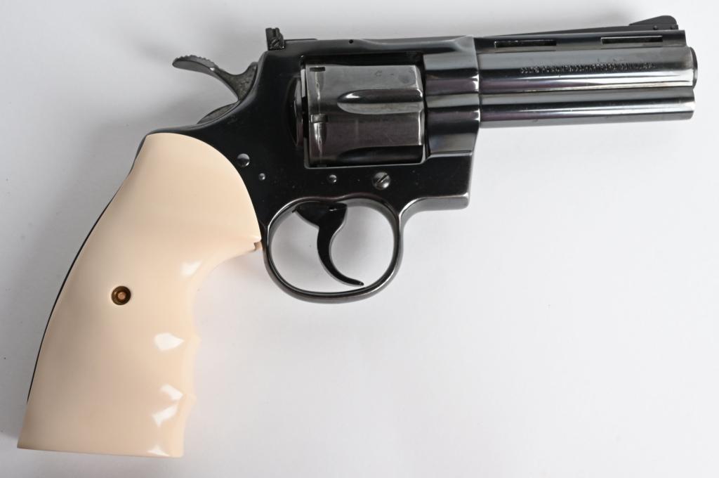 COLT PYTHON DOUBLE ACTION REVOLVER: SERIAL V70478. BARREL 4". CALIBER .357 MAGNUM. MADE IN 1979. Offered is a fine late 70's Python that has already been fired. If you love shooting the Python or have always wanted one but did not want