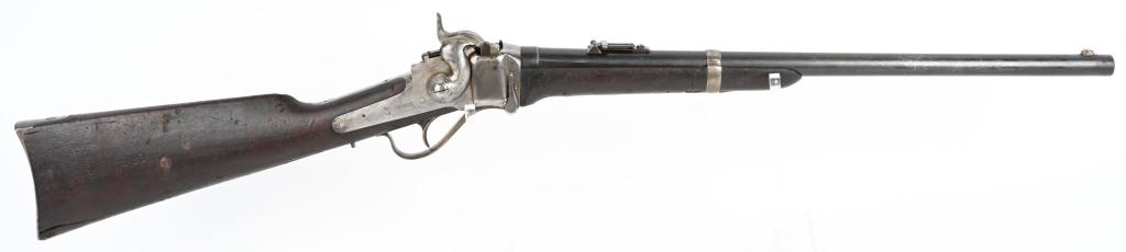 SHARPS 1865 CONVERSION CARBINE SILENT FILMS GUN: SERIAL C1824. BARREL 22". CALIBER .50. This is an interesting carbine. Basically, it is a standard post Civil War conversion to metallic cartridge from an original percussion carbine. The left side of