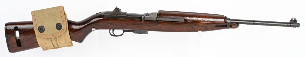 WW2 QUALITY H.M.C. MARKED M1 CARBINE: SERIAL NUMBER 1875929 BARREL 18" CALIBER 30 M1 CARBINE MANUFACTURE WW2. Early production with undated Rock-Ola barrel, type 1 barrel band and non-staked flip sight marked UI. Unmarked push button safe