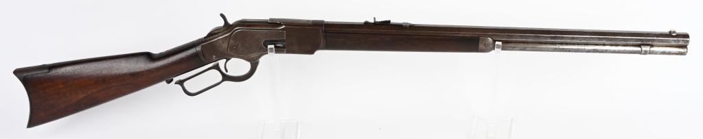 WINCHESTER MODEL 1873 LEVER ACTION 44 RIFLE: SERIAL 118256. BARREL 24". CALIBER 44-40. MADE IN 1883. Features full heavy octagon barrel, full magazine, Winchester flat top rear sight, Winchester nickel front sight, walnut stocks, rifle butt.. Me