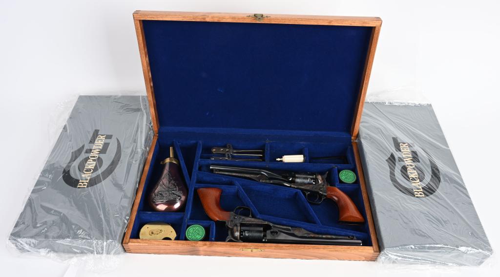 CASED/BOXED PR. COLT 1861 NAVY REVOLVERS: SERIAL 43297 & 43387. BARRELS 7.5". CALIBER 36 PERCUSSION. This a pair of 61 signature series Colt Navies. They are identical in finish and features to include stock cut, blue & case color, cylinder n
