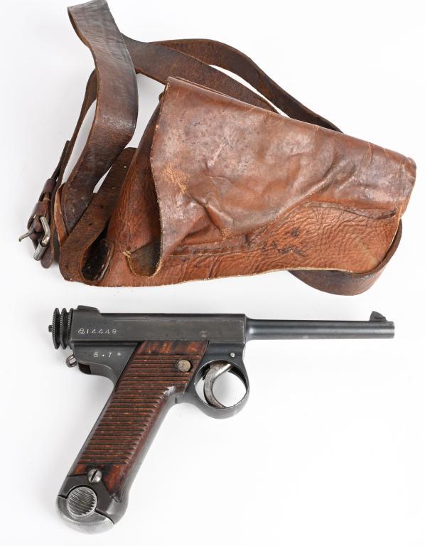 TOKYO ARSENAL SMALL GUARD TYPE 14 NAMBU PISTOL: SERIAL NUMBER 14449, BARREL 4.6 "CALIBER 8MM NAMBU, MANUFACTURED JULY 1930. Produced at Tokyo Arsenal and dated July 1930. Blue finish with grooved wood panel grips. 2 groove knurled cocking handle, s