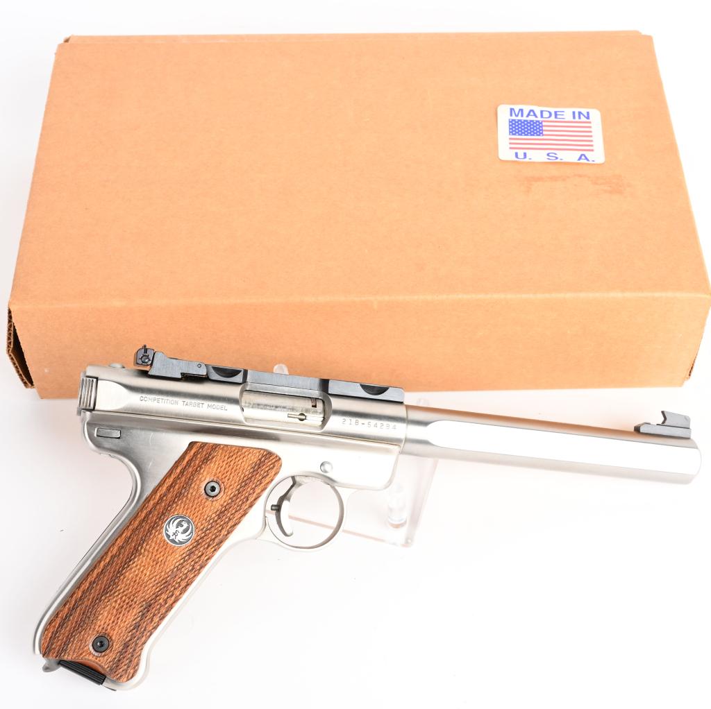 BOXED RUGER STAINLESS MK II SEMI AUTO PISTOL: SERIAL 218-54284. BARREL 6 3/4". CALIBER .22 LONG RIFLE. This fine target pistol is in as new condition in cardboard box with one magazine. Features slab side barrel, target sights, Picatinny rail and