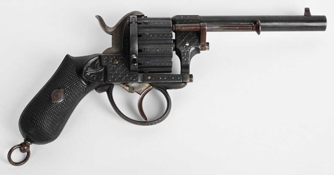 FINE ENGRAVED 12-SHOT BELGIUM PINFIRE REVOLVER: SERIAL 13055. BARREL 4 3/4\". CALIBER 8MM. Extremely fine and ornate Belgium copy of The Lefaucheux M1858. This is the desirable 12 shot double action with fancy checkered gutta percha bag grips with 