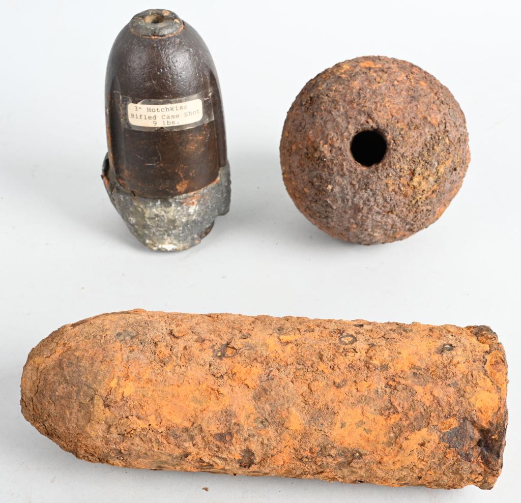 CIVIL WAR ARTILLERY SHELL LOT OF 3 DUG SHELLS: Collection of spent artillery rounds to include 1) Dug Federal 12-pound spherical shell. 2) Dug Federal 10 Pound Parrot Artillery Shell. 3) Three Inch Hotchkiss Rifled Case Shot.