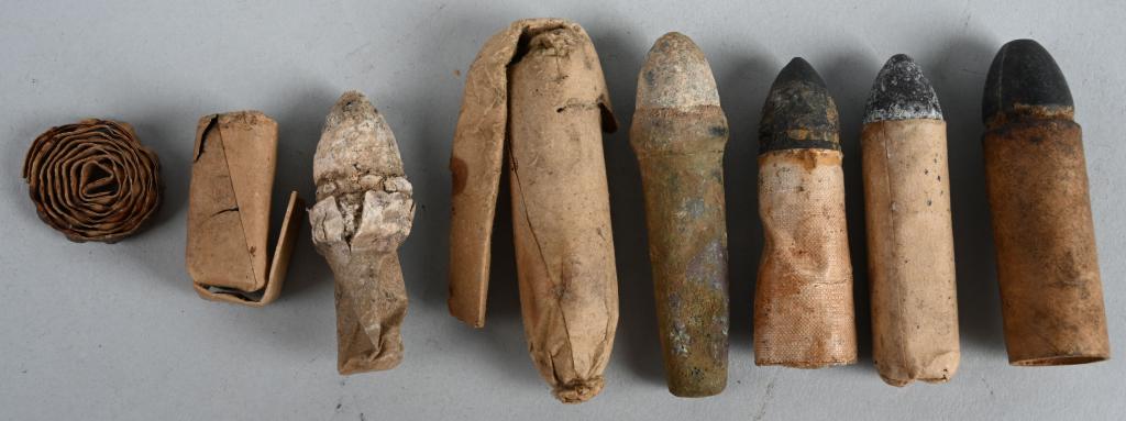 CIVIL WAR CARTRIDGE LOT MERRILL SPENCER BURNSIDE: Lot of Civil War related cartridges including 1) .58 caliber cartridge still wrapped and in excellent condition. 2) Maynard primer tape caps in excellent condition. 3) Dug Burnside carbine cartridge i