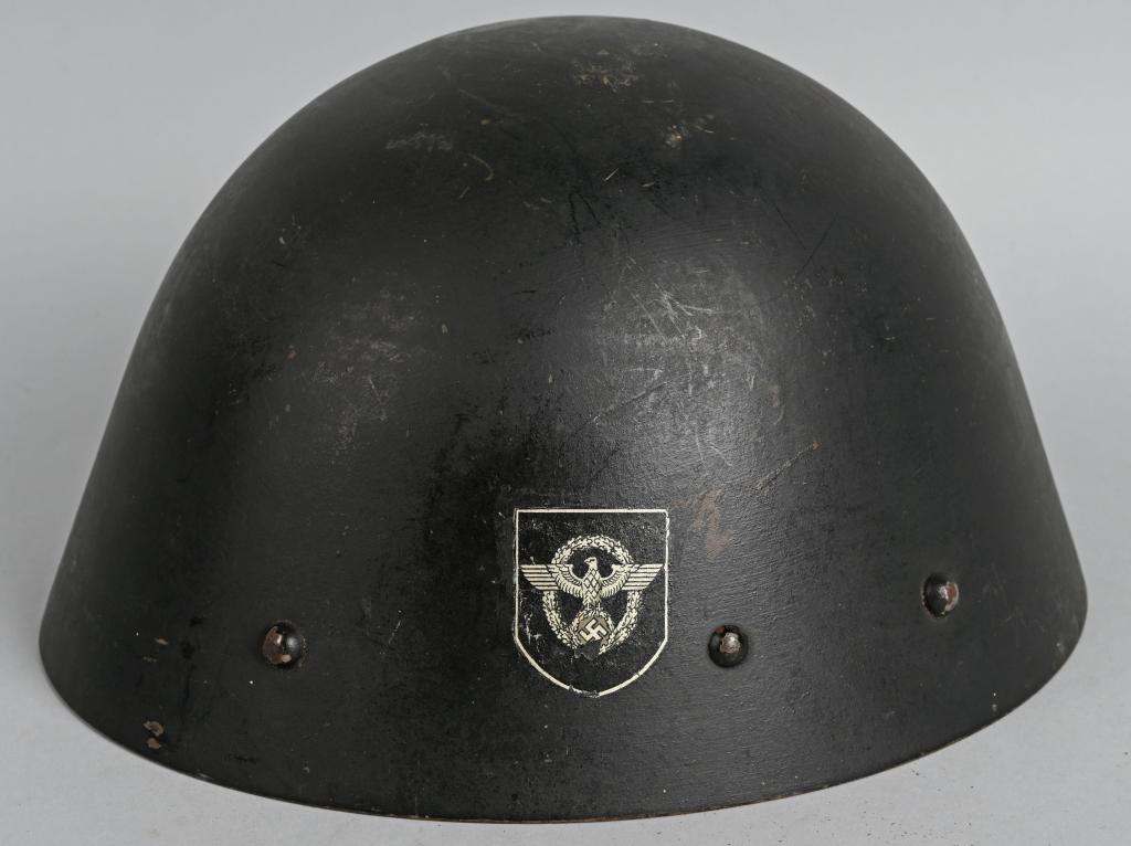 WWII VZ32 CZECH RE-ISSUE GERMAN POLICE HELMET: This is a rather extremely hard to find VZ32 Czech helmet that has been Nazi era re-issued to the German police. Exterior does display some wear with approx 95% of the factory paint remaining. Silver 