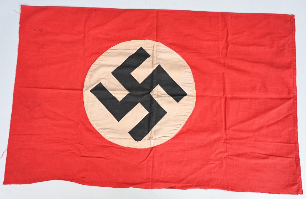 WWII NAZI GERMAN NSDAP WALL BANNER OR FLAG WW2: Multi-piece cotton construction flag approximately 20 1/2 x 33 inches . To both its red fields are sewn are white disks, with separately sewn on mobile swastikas in black. Shows the expected light per