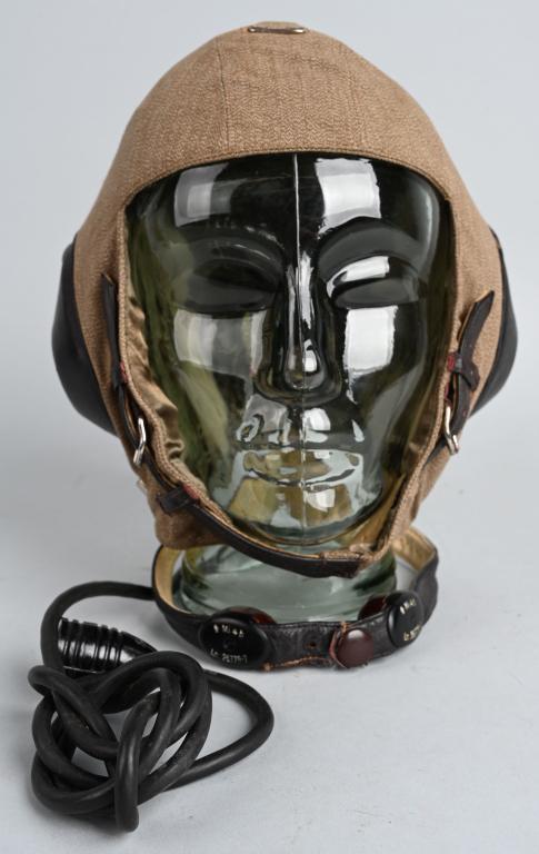 WWII NAZI GERMAN LUFTWAFFE SUMMER FLIGHT HELMET: Nice quality five panel, tan linen construction summer flight helmet with integral communications equipment sheet metal molded Bakelite and brown leather fittings and a brushed green rayon lining. Siz