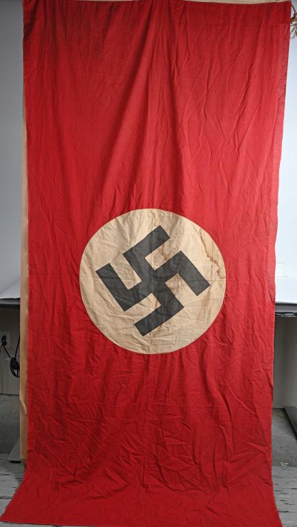 WWII NAZI GERMAN NSDAP NATIONAL FLAG WW2 51 X 106: Multi-piece cotton construction banner approximately 51 X 106 inches. To both its red fields are sewn white disks with a printed mobile swastikas in black. Worn and sun faded with staining. Tunnel loo