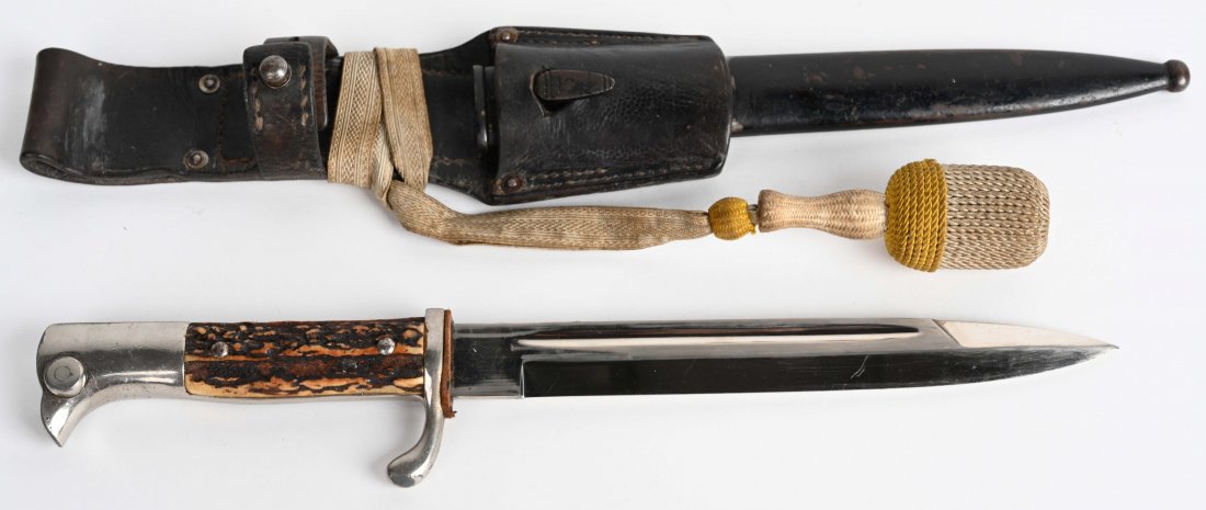 WWII NAZI GERMAN LUFTWAFFE DRESS BAYONET EICKHORN: Signed on the ricasso with Eickhorn sqirrel mark. Features stag grips, and comes with white and yellow bayonet knot / porteppe in original scabbard with leather frog. Frog has a letter "L" stamped on 