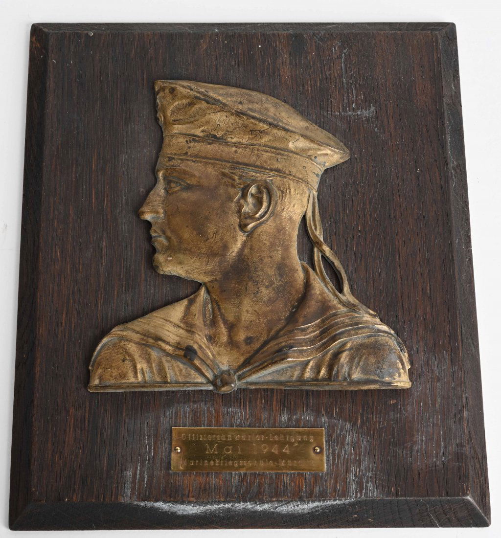 WWII NAZI GERMAN KRIEGSMARINE SCHOOL PLAQUE 1944: Wooden plaque with two brass pieces, one depicting a right-facing German Kriegsmarine sailor in uniform and the other reading "Offiziersan warterLehrgang MAI 1944 and Marinekriegsschule - Murwik. The