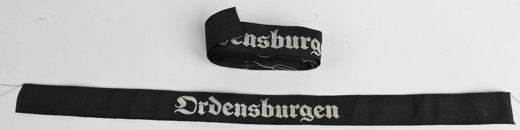 WWII NAZI NSDAP ORDENSBURGEN CUFFTITLE LOT OF 10: Lot of 10 early pattern, black rayon construction cufftitles with machine woven Gothic script in bright silver/aluminum flat-wire threads, "Ordensburgen". After Hitler’s assumption of power in Janua