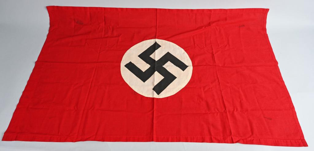 WWII NAZI GERMAN NSDAP WALL FLAG OR BANNER WW2: Multi-piece cotton construction banner approximately 27 x 28 inches. To both its red fields are sewn white disks, with a printed mobile swastikas in black. Shows the expected period use and wear but o