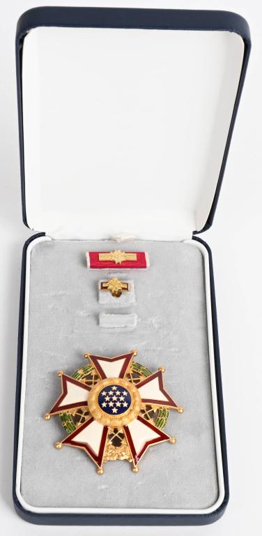 LEGION OF MERIT CHIEF COMMANDER DECORATION SET: Post-Vietnam War era decoration set, complete with breast star, correct ribbon bar and lapel pin in padded blue "Arrow" brand case. United States; Sterling silver gilt with red, white, blue and green 