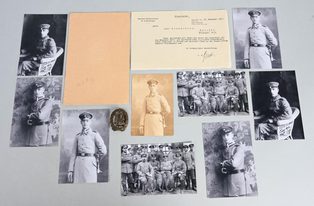 WWII NAZI GERMAN DRL SPORTS BADGE W/ DOCUMENTS WW2: Award document and a 1937 pattern die struck bronze award. The badge is in the form of a vertical oval oak leaf wreath, with a mobile swastika and bow to its base, encompassing the stylized, cut-out l