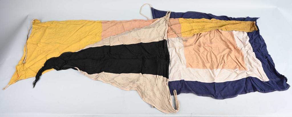 3 WWII JAPANESE NAVY SIGNAL PENNANTS CARRIERS: Pair of World War II era Japanese Naval Signal / Semaphore flag pennants. One is black and white and measures approximately 40" long and 32" at the hoist. This one, with a horizontal black stripe and 
