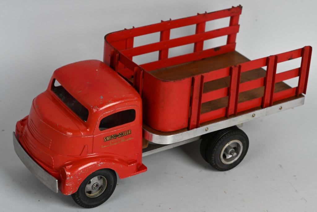 SMITH MILLER STAKE BED TRUCK: Original Smith Miller Stake Bed Truck. Nice paint and decals. One side the tires are loose but all present. No breaks. 14" Excellent