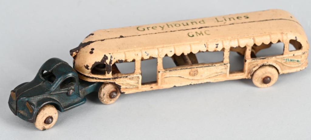 7 1/2" ARCADE CAST IRON GREYHOUND LINES GMC BUS: Original Arcade Greyhound Lines GMC Bus. This was the style bus used to shuttle people at the 1933 Chicago Worlds fair. Nice factory paint. Has original white rubber tires. 7 1/2" Excellent