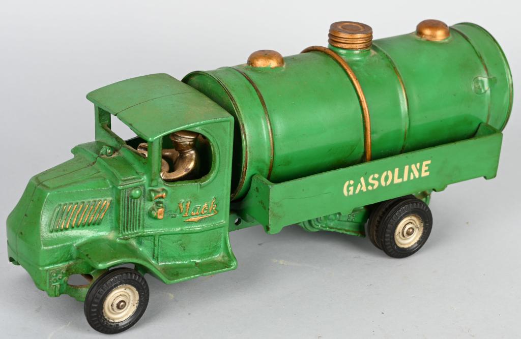 ARCADE CAST IRON MACK GASOLINE TRUCK: Excellent original Mack Gasoline Truck. This truck has exceptional factory paint. Gold highlights and white lettering looks wonderful. Has original wheels. A very desirable truck is amazing original c