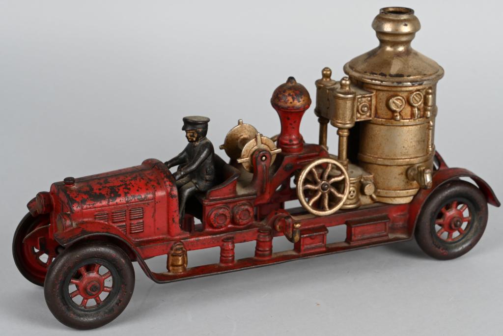 KENTON CAST IRON BOILER FIRE TRUCK: Original Kenton Boiler Fire Truck. Has factory paint with nickel plated boiler and parts. Comes with period driver not original to the truck. A large cast iron toy. 14 1/2" Very Good