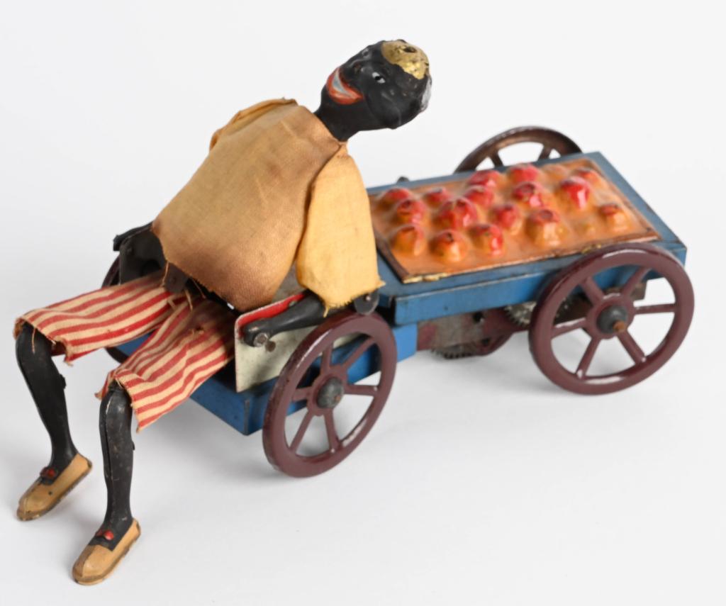 FERNAND MARTIN TIN WINDUP ORANGE VENDOR: Excellent all original Fernand Martin Orange Vendor. Very nice colors and details. Windup works. 7" Excellent