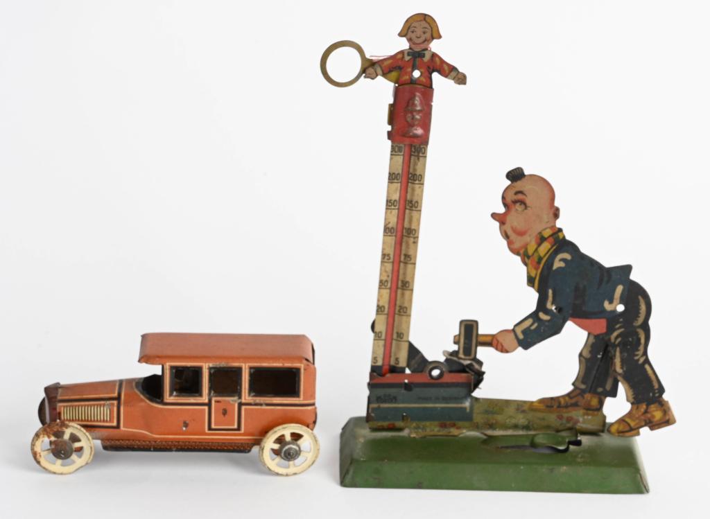 GERMAN CLOWN STRENGTH TOY & PENNY TOY CAR: Both all original and in great condition. Largest 6 3/4" Excellent