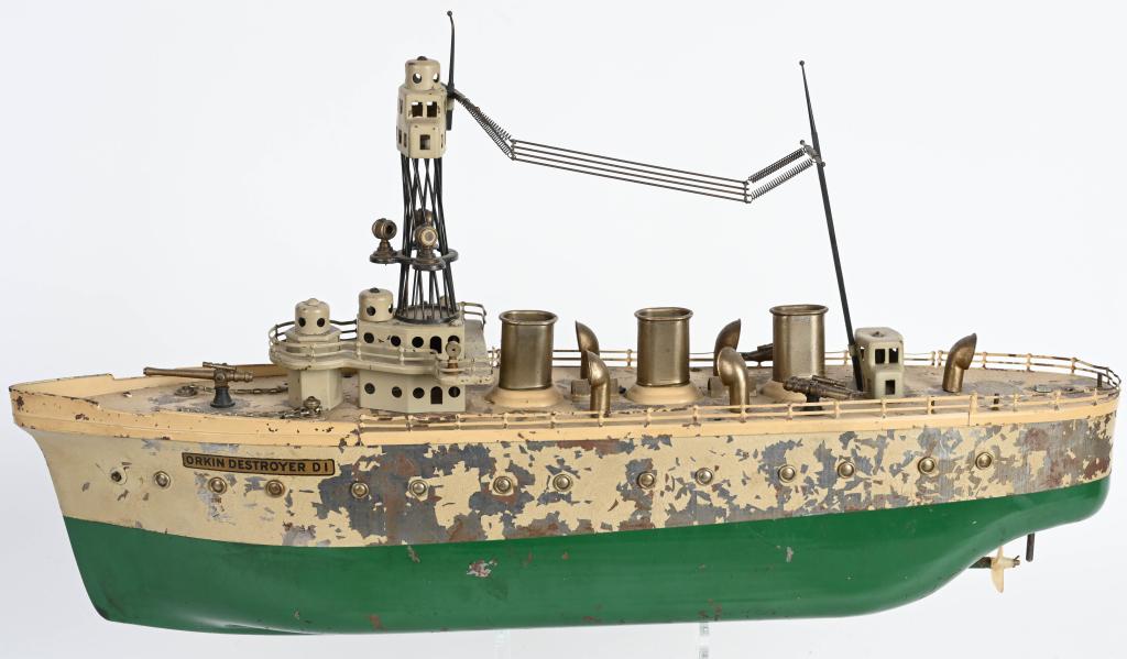 ORKIN CLOCKWORK DESTROYER D-1: Original Orkin Clockwork Destroyer D-1. Windup motor works. Still has all its deck guns an accessories. Has some paint loss. Rear rudder is missing as per usual. 24" Very Good