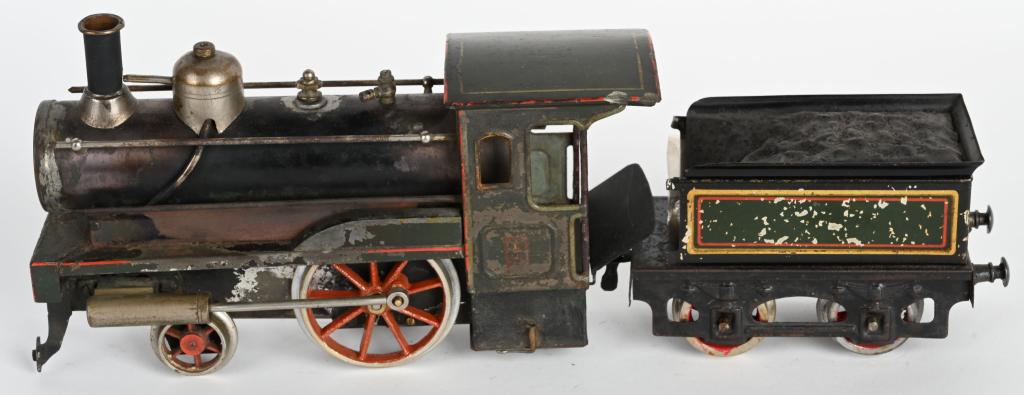 CARETTE 1 GA LIVE STEAM LOCOMOTIVE & TENDER: Carette 1 gauge Live Steam Locomotive and Tender. In all original condition. Locomotive missing whistle and front bumpers and coupler. 14"