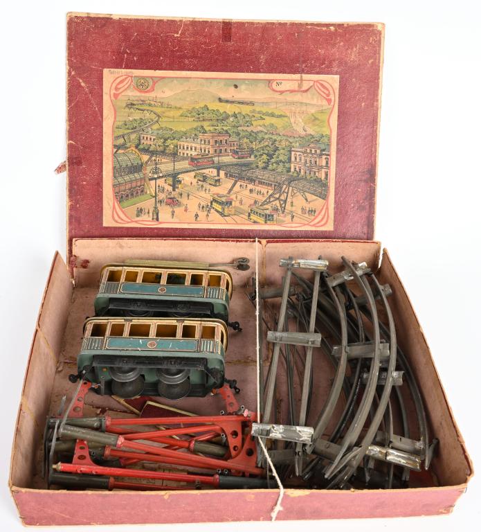 CARETTE O GA TROLLEY & TRAILER SET w/ BOX: Wonderful original Carette O gauge Trolley and Trailer Set. Trolley and Trailer are all original blue color with great details. Set is complete with Track and Catenary Poles. With original Box. Trolle
