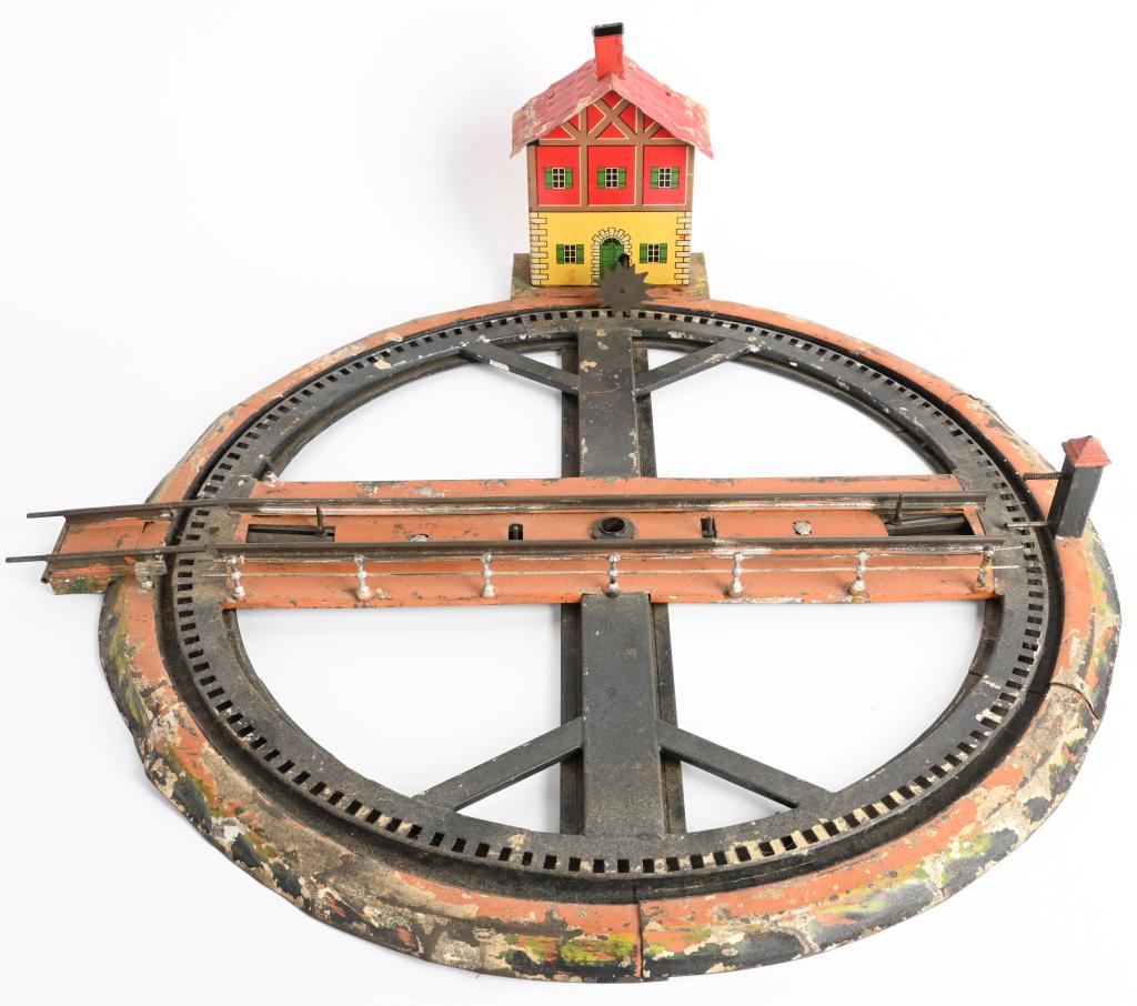 MARKLIN O GA CLOCKWORK ROUND ABOUT STATION: Early Marklin O gauge Clockwork Round About Station. Very nice details. Windup works. Hand painted with litho Station. 21" Excellent
