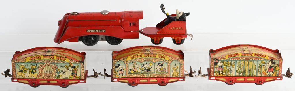 LIONEL MICKEY MOUSE CIRCUS SET: Original Lionel Red Tender with Mickey Mouse shoveling coal Tender. Comes with all 3 original cars. Cars have excellent colors and graphics. All original great looking set. The Mickey is missing the p