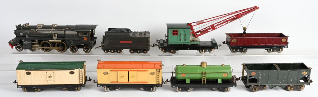 PRE-WAR LIONEL 400E ENGINE & TENDER w/ 6 FREIGHT: Pre-war lionel 400e engine & tender w/ 6 freight cars. Lionel 400e engine original condition gun metal gray excellent condition. 392w tender with whistle excellent condition. 212 gondola, 214r refrige