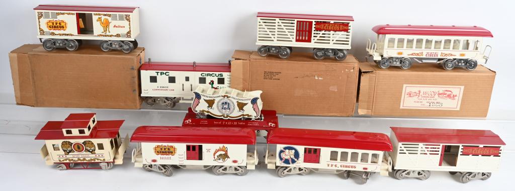 McCOY LOT OF 9 WIDE GA CIRCUS CARS: McCoy lot of 9 wide ga circus cars. 255 Pullman w/box, 2 TPC cattle car 1 w/box, 255B baggage car, 255c baggage car, Sultan box car, X256CC commissary car, flat car 1072 w/ carriage wheels on carriage
