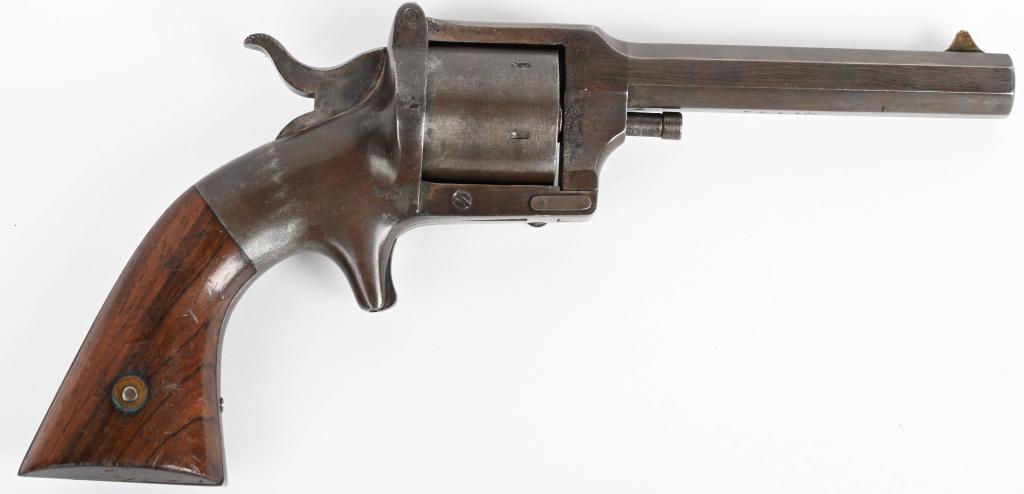 L W. POND RIMFIRE BELT REVOLVER: SERIAL 5466. BARREL 4". CALIBER .32 RIMFIRE. MADE FROM 1861-1870. This is an iron frame model, 6-shot, single action, spur trigger, octagon barrel with two piece walnut grips. This is one of 4486 pist