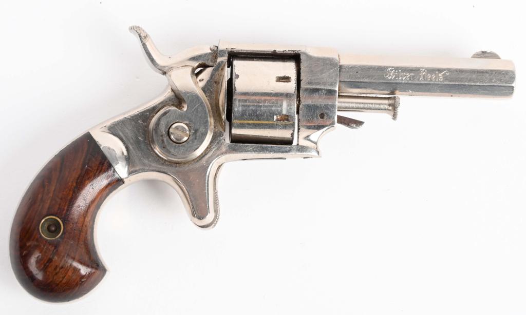 ETHAN ALLEN ANTIQUE POCKET REVOLVER: NSN. BARREL BARREL .2.5". CALIBER .22 RIMFIRE SHORT. Features nickel finish, 7-shot, single action , spur trigger, octagon barrels with rosewood bird head grips. 90% original nickel . Excellent grips.