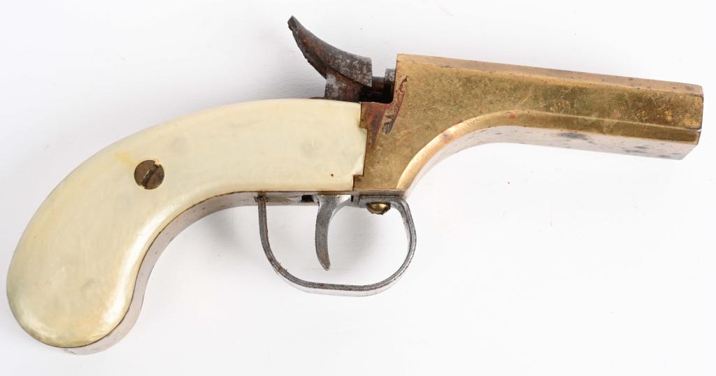 REPRODUCTION BRASS FRAMED DOUBLE MUFF PISTOL: SERIAL NUMBER 4341S, BARREL 3-1/8" CALIBER .36 SMOOTH BORE, MANUFACTURE NAVY ARMS. .36 caliber Brass framed double Derringer or Muff pistol with faux mother of pearl grips. Single trigger fired single