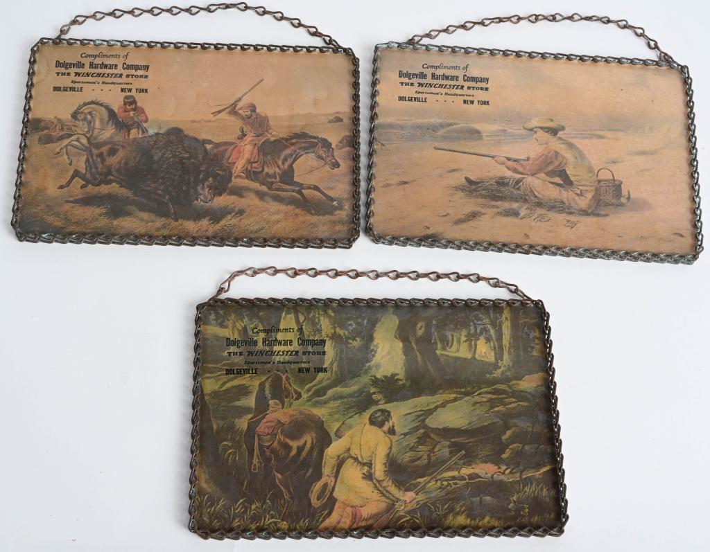LOT (3) WINCHESTER ADVERTISING SMALL SIGNS.: Three color hunting images , full color, with chain mail frame & hangers. All measure 5x7 with Dolgeville Hardware company stamped on top corner. All excellent.