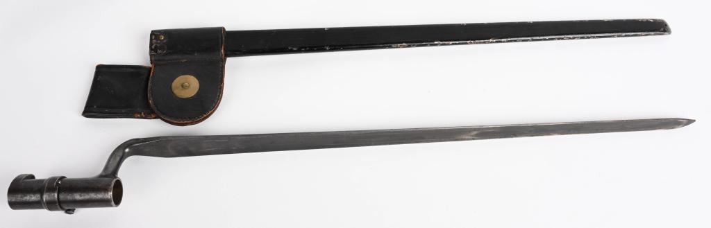 US MODEL 1873 BAYONET FOR THE TRAPDOOR SPRINGFIELD: A blued, 46cm (18") long, tapering triangular blade with fullers to all three sides with the blade marked "U.S." The socket is approximately 7.6cm (3") long. Included is the rolled, sheet metal scabba